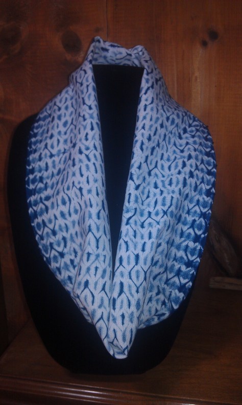 Woven shibori circle scarf, embellished with indigo-color glass beads along the long edges.