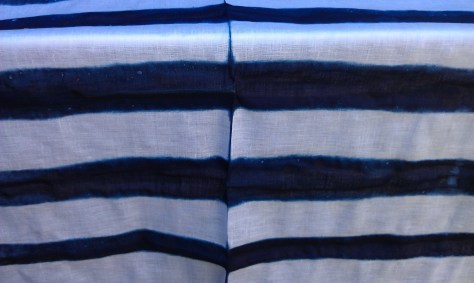 Linen, that was folded and clamped between pieces of wood.