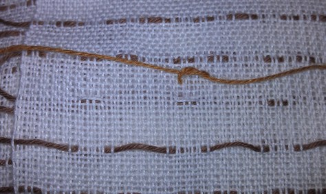 Weaving is checked over for any needed repairs.