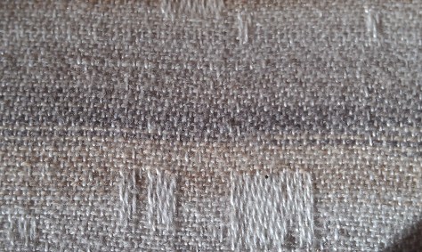 Tiny spots of white where they should not be.