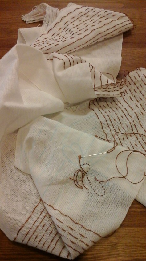 Beginning to stitch the dragonflies on a border.