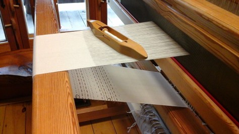 Woven shibori scarf, border on each end, and free-stitching area.