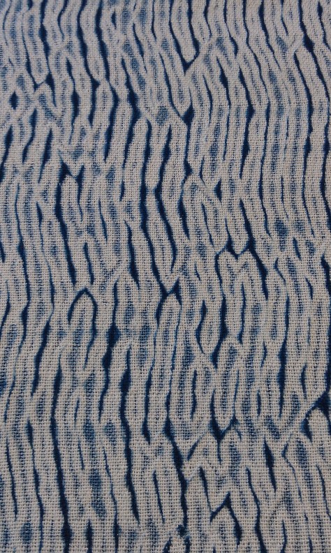 Detail shot of the woven shibori mobius scarf.