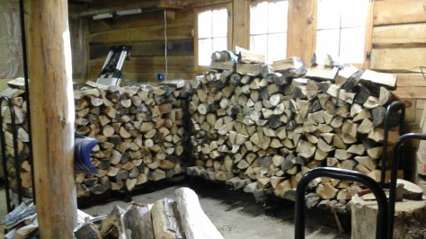 Two double wood racks full, in the garage.